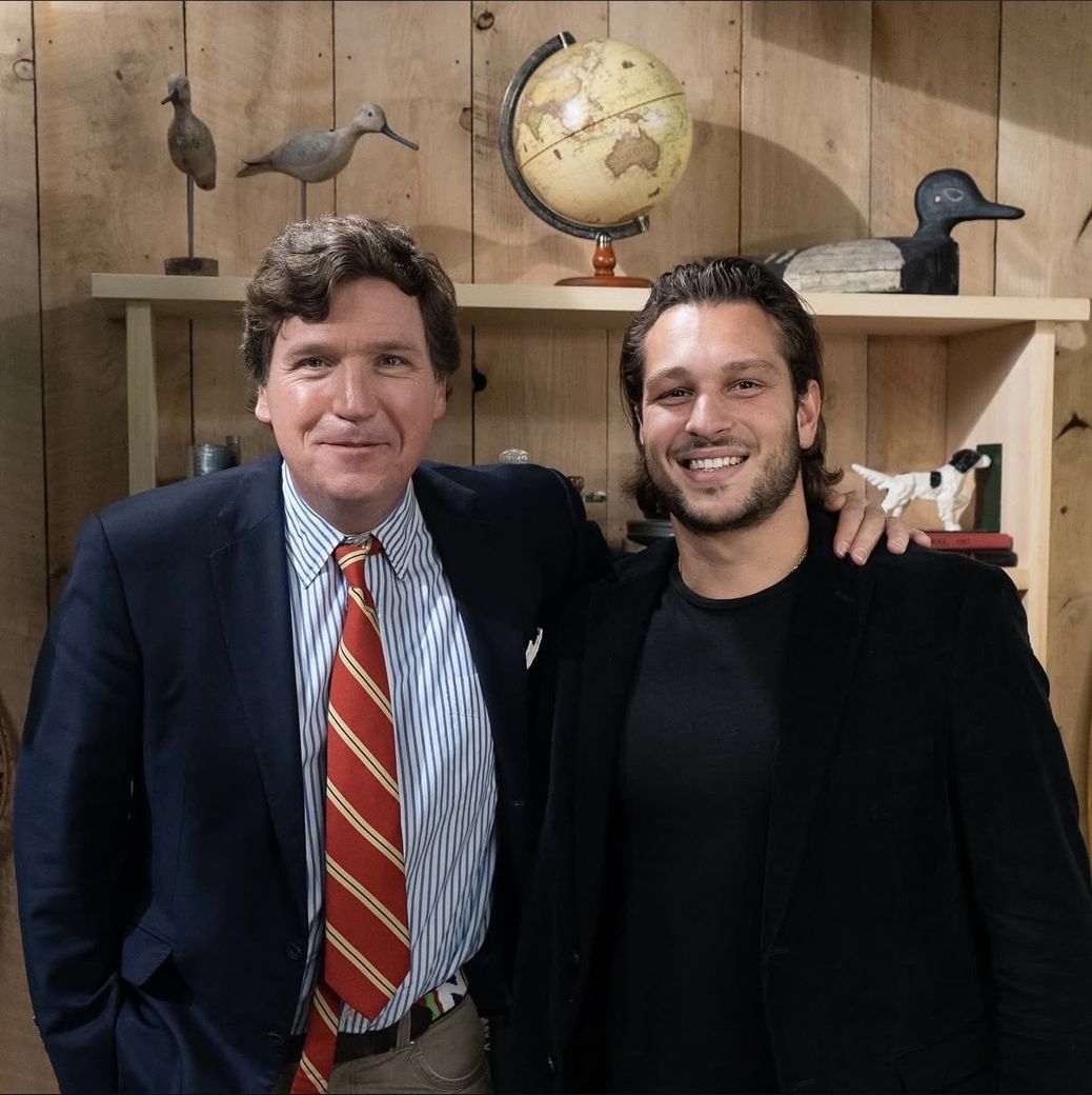 With Tucker Carlson